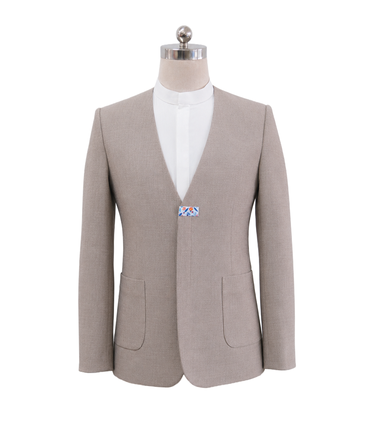 modoleen-beige-mens-collarless-suit-jacket.jpg Men's collarless corporate suit jacket in light tan beige featuring a deep round V-cut neckline, single center floral bow-tie clasp fastener, and front patch pockets, designed by Modoleen Singapore for luxury hospitality, spa, and wellness uniform programs.