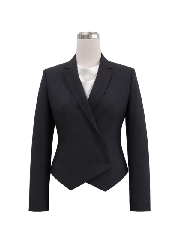 Women's tailored asymmetric wrap corporate blazer in solid black featuring a structured notch lapel, overlapping angled front hemline, and fitted silhouette, styled over an ivory silk blouse, designed by Modoleen Singapore for executive leadership and office uniform programs.
