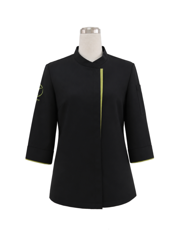 Ladies black elbow length sleeve chef coat featuring a mandarin collar and contrasting green piping trim, designed by Modoleen Singapore for professional culinary and hospitality uniform programs.