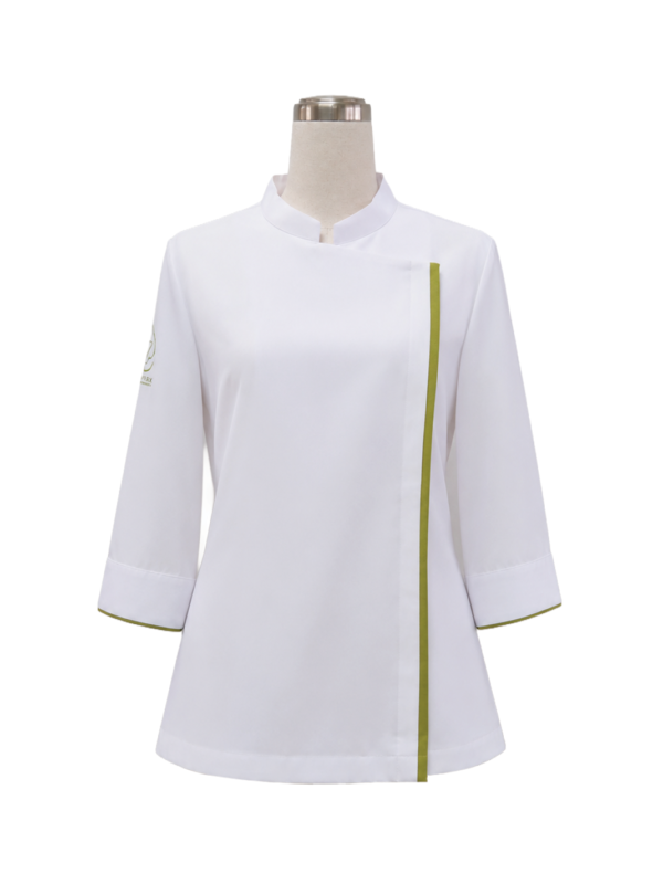 Women's 3/4 sleeve culinary chef jacket in crisp white featuring a standing mandarin collar, concealed front placket, and olive green piping trim along the front opening and sleeve cuffs, designed by Modoleen Singapore with custom color, fabric, and logo print options for culinary and hospitality uniform programs.