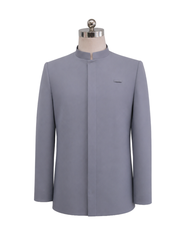 Men's professional mid-grey front-desk corporate suit jacket with tailored notch lapels and waist flap pockets, styled with a turquoise silk tie and patterned pocket square, designed by Modoleen Singapore for Hilton Singapore hotel management and hospitality uniform programs.