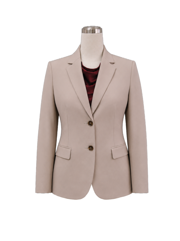 Women's tailored two-button corporate suit jacket in light taupe beige featuring a structured notch lapel, side flap pockets, and fitted waist shaping, styled over a burgundy silk blouse, designed by Modoleen Singapore for executive leadership and office uniform programs.