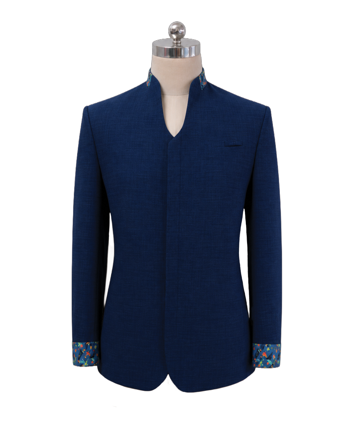 modoleen-mens-navy-mandarin-collar-supervisor-jacket.jpg Men's corporate standing collar jacket in dark navy blue featuring a clean V-cut neckline, concealed front placket, and vibrant tropical batik pattern accents along the inner collar and turned-up cuffs, designed by Modoleen Singapore for corporate leadership and hospitality uniform programs.