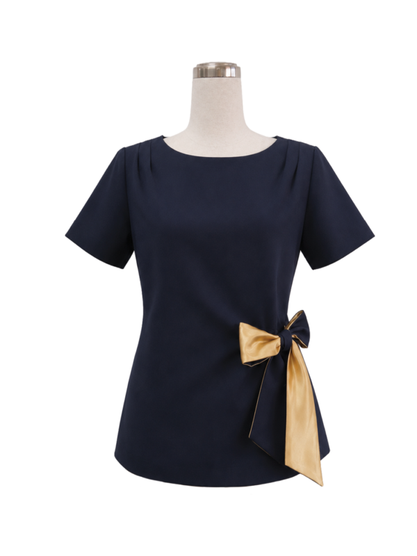 Women's tailored short-sleeve corporate uniform tunic in dark navy blue featuring neckline pleats and an elegant side-waist gold satin bow sash, designed by Modoleen Singapore for office wear and hospitality programs.
