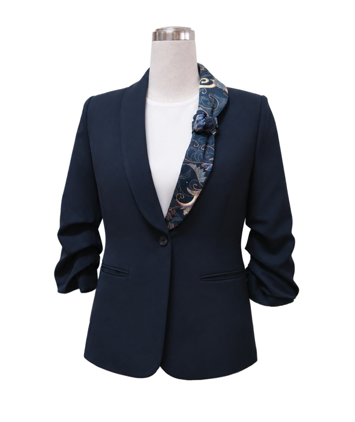 modoleen-navy-corporate-jacket-batik-accent.jpg Women's tailored single-button corporate blazer in dark navy blue featuring ruched 3/4 sleeves, a sleek shawl lapel, and a custom patterned batik scarf accent, designed by Modoleen Singapore for executive leadership and hospitality uniform programs.