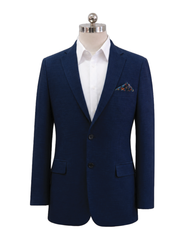 Men's classic two-button corporate suit blazer in dark navy blue featuring tailored notch lapels, side flap pockets, and a patterned pocket square accent, styled over a white dress shirt, designed by Modoleen Singapore for corporate leadership and hospitality uniform programs.