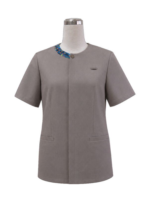 Women's short-sleeve corporate tunic top in taupe grey featuring a crewneck collar with a contrast blue patterned split accent and concealed button placket, designed by Modoleen Singapore for receptionist, administrative, and hospitality uniform programs.