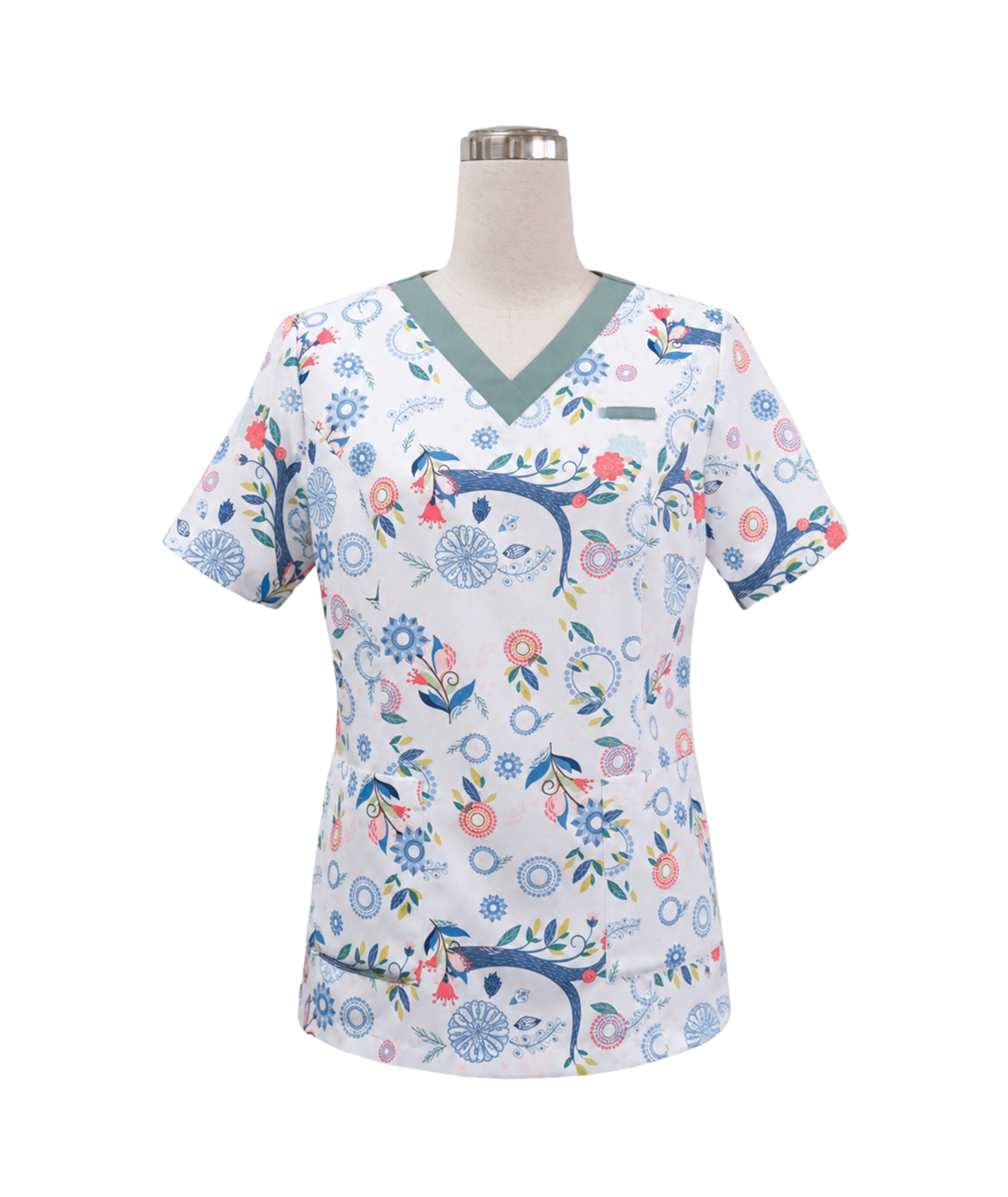 modoleen-white-floral-vneck-medical-scrub-top.jpg Women's short-sleeve medical scrub top featuring a teal-green V-neckline, custom printed floral pattern designed by Modoleen, and functional front pockets, tailored by Modoleen Singapore for healthcare, palliative care, and Assisi Hospice clinical staff uniform programs.