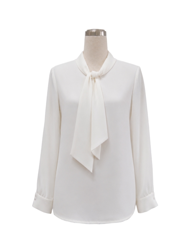 Women's tailored long-sleeve corporate pussybow blouse in off-white chiffon featuring an integrated neck scarf tie and structured button cuffs, designed by Modoleen Singapore for executive leadership and hospitality uniform programs.