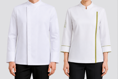 Professional culinary uniform set featuring a men's long-sleeve crisp white chef jacket with an asymmetrical standing collar and hidden placket, alongside a women's 3/4 sleeve white chef coat with olive green piping trim, designed by Modoleen Singapore.